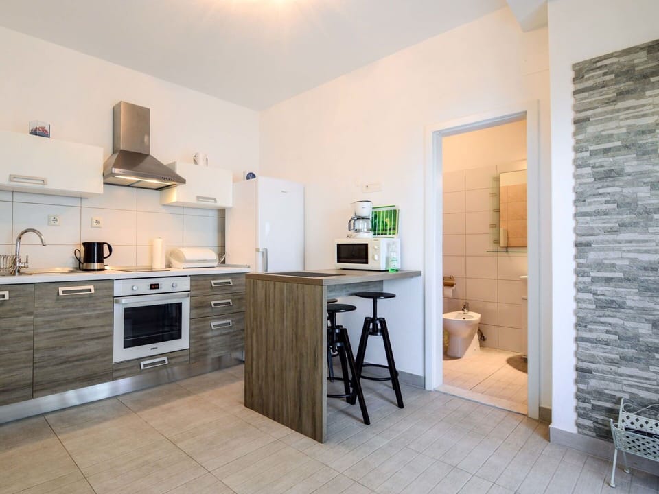Cabinetry, Countertop, Furniture, Building, Kitchen Appliance, Kitchen Stove, Wood, Kitchen, Home Appliance, Lighting