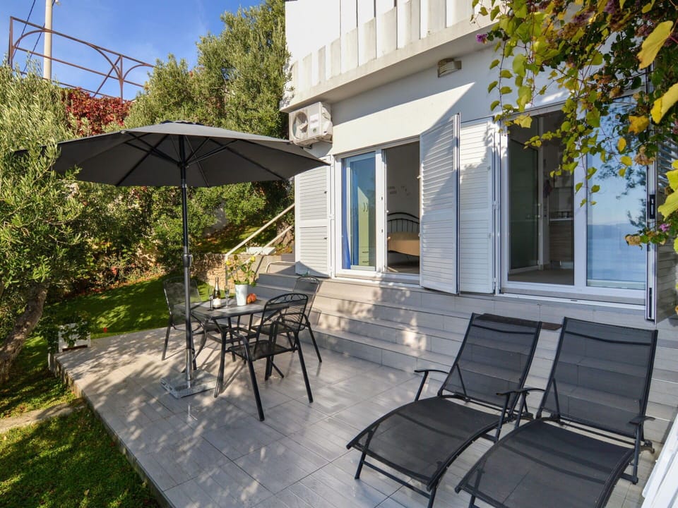 Furniture, Building, Property, Plant, Table, Shade, Road Surface, Outdoor Furniture, Tree, Lighting