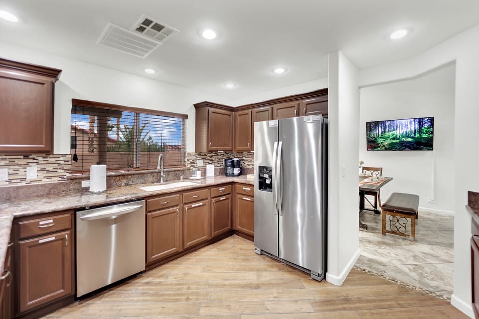 Admire the newly renovated interiors, featuring wood-like tile planks, sleek new vanities, and glistening granite countertops, creating an ambiance of sophistication and comfort.