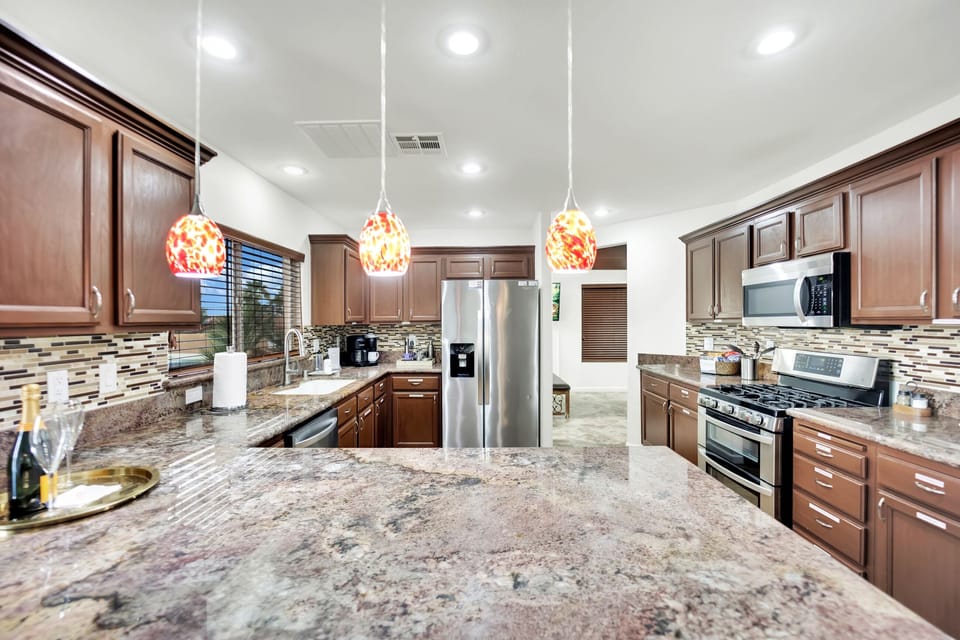 Whether you're hosting a casual gathering or a formal dinner party, the kitchen's convenient layout ensures that everyone can be part of the festivities.