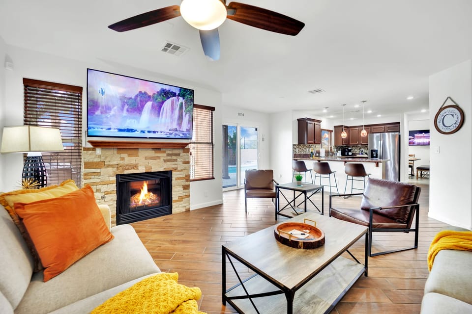 Meanwhile, the spacious living room serves as the heart of the home, offering ample space for relaxation and entertainment, with a lovely fireplace to enjoy a beverage. With smart TVs strategically placed throughout the living, dining, & bedrooms.