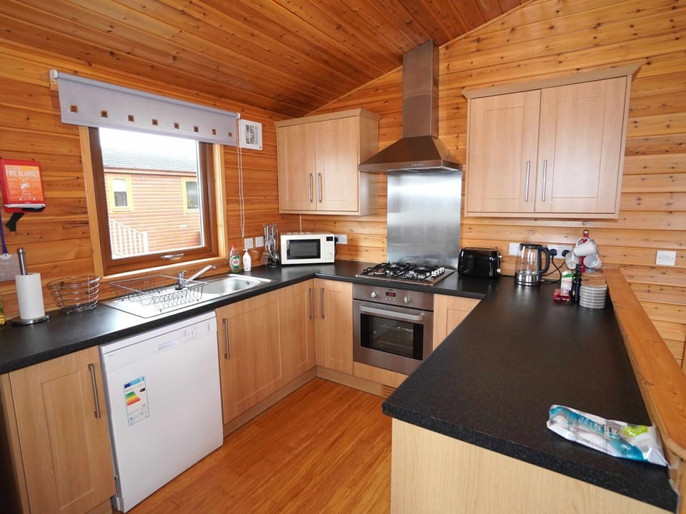 Cabinetry, Countertop, Kitchen Appliance, Kitchen, Home Appliance, Kitchen Stove, Wood, Interior Design, Flooring, Floor