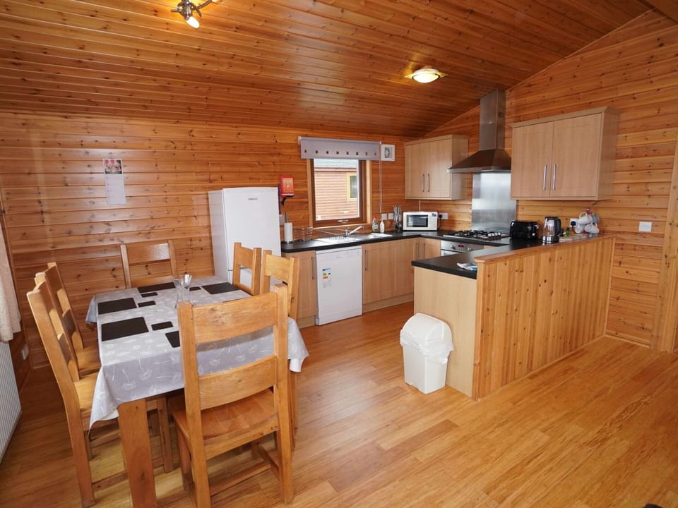 Table, Property, Cabinetry, Wood, Interior Design, Countertop, Flooring, Floor, Wood Stain, Kitchen