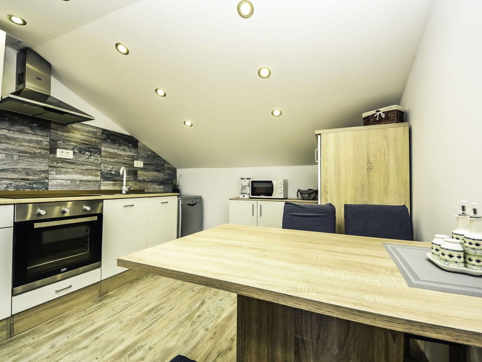 Table, Cabinetry, Furniture, Property, Countertop, Drawer, Wood, Kitchen, Kitchen Stove, Interior Design