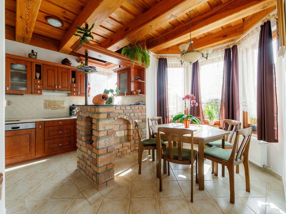 Furniture, Table, Cabinetry, Wood, Chair, Curtain, Interior Design, Flooring, Floor, Window