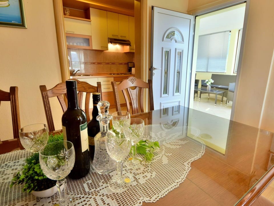 Table, Furniture, Tableware, Property, Plant, Drinkware, Building, Chair, Stemware, Wood