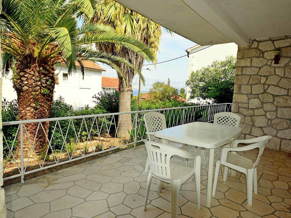 Plant, Property, Furniture, Building, Botany, Lighting, Outdoor Furniture, Architecture, Shade, Grass