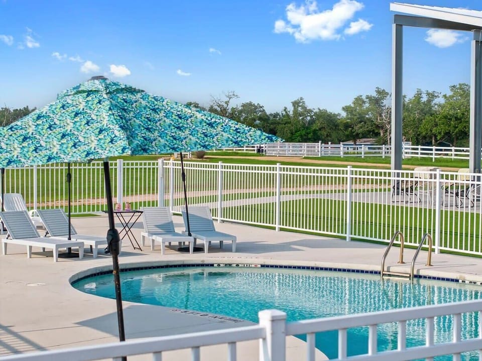 Relax by the outdoor swimming pool