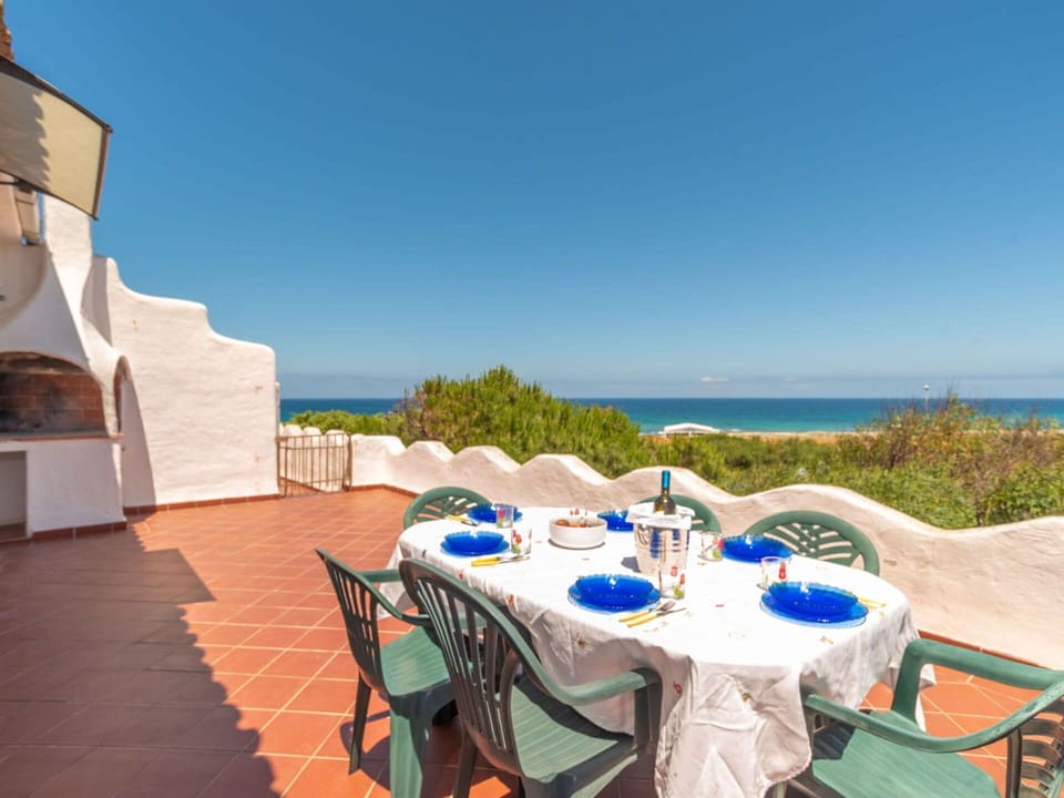 Sky, Table, Water, Furniture, Tableware, Seaside Resort, Chair, Azure, Plant, Outdoor Furniture