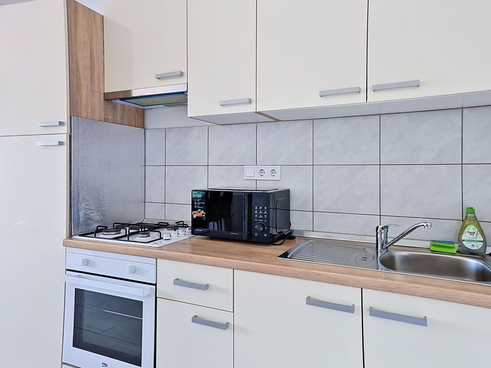 Major Appliance, Flooring, Wood, Kitchen, Interior Design, Kitchen Appliance, Countertop, Floor, Kitchen Sink, Cabinetry