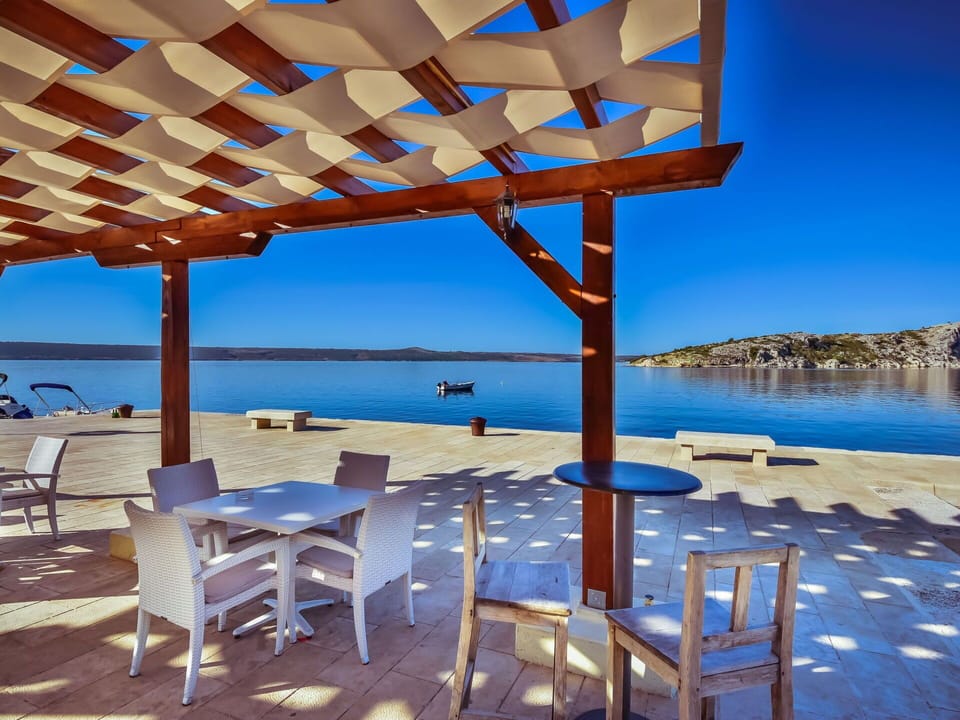 Water, Sky, Furniture, Property, Blue, Table, Shade, Azure, Chair, Outdoor Furniture