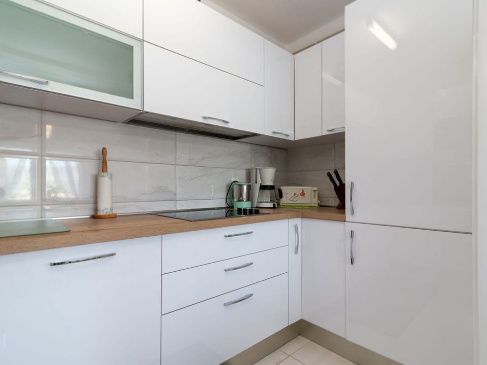 Cabinetry, Countertop, Building, Furniture, Property, Kitchen Appliance, Kitchen, Drawer, Wood, Tap