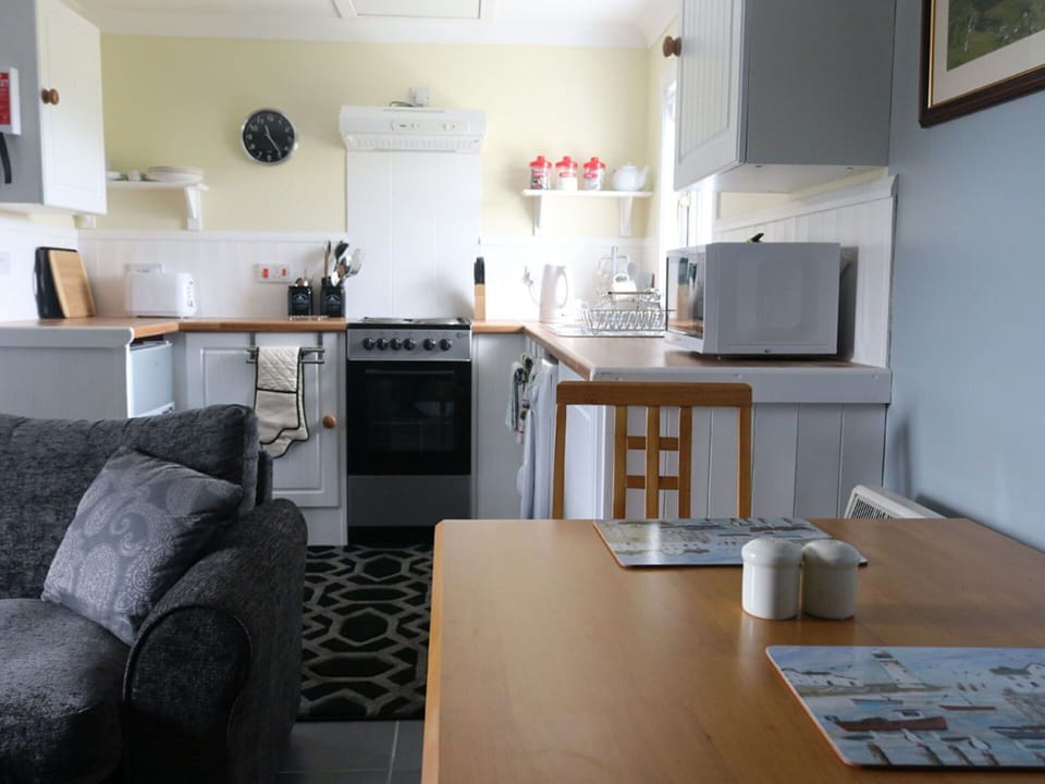 Furniture, Picture Frame, Table, Cabinetry, Kitchen Appliance, Kitchen, Interior Design, Wood, Countertop, Home Appliance