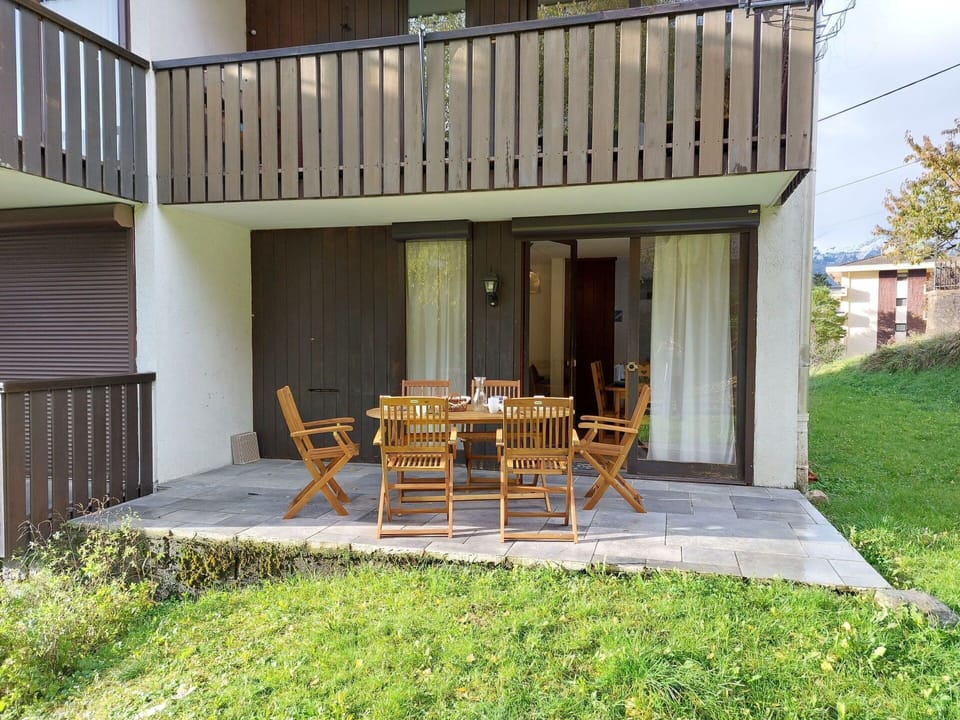 Plant, Building, Table, Wood, Chair, Shade, Interior Design, Land Lot, Grass, Window