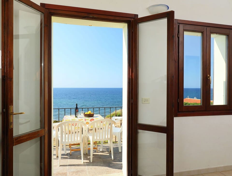 Water, Daytime, Property, Sky, Building, Azure, Door, Shade, Wood