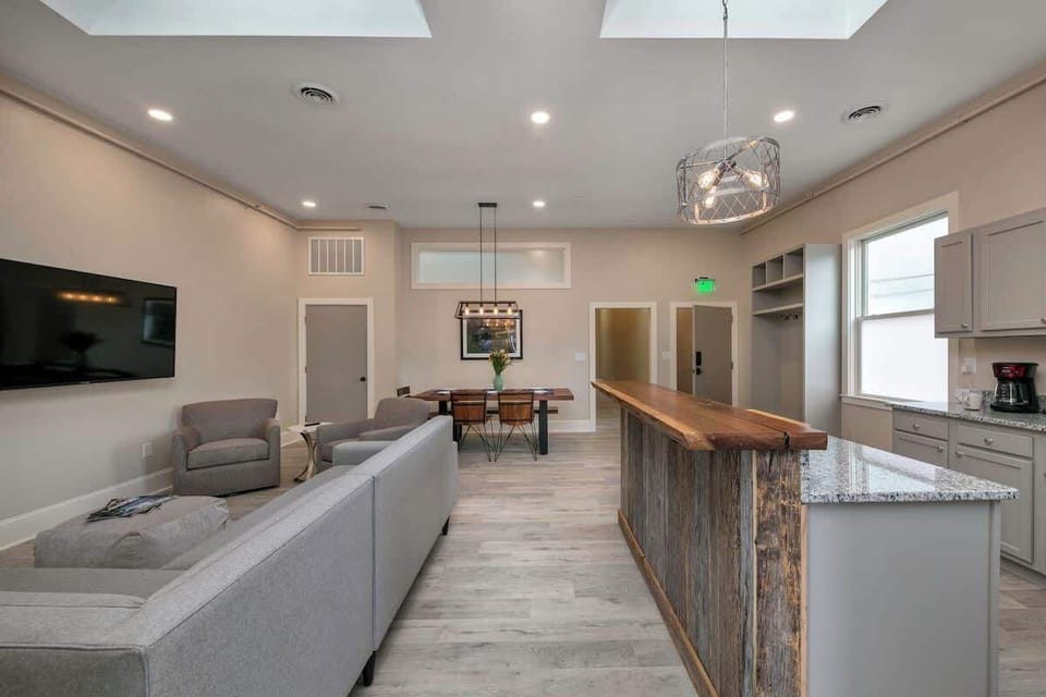Open-concept living room with kitchen and dining area
