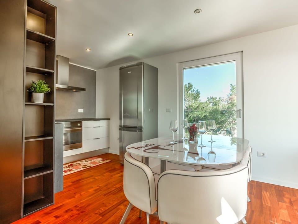 Cabinetry, Furniture, Countertop, Wood, Flooring, Interior Design, Floor, Building, Chair
