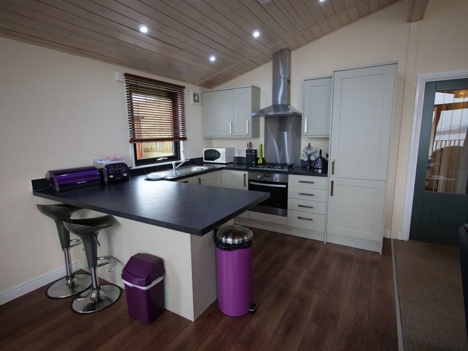 Cabinetry, Furniture, Countertop, Table, Kitchen, Home Appliance, Chair, Kitchen Appliance, Wood, Interior Design