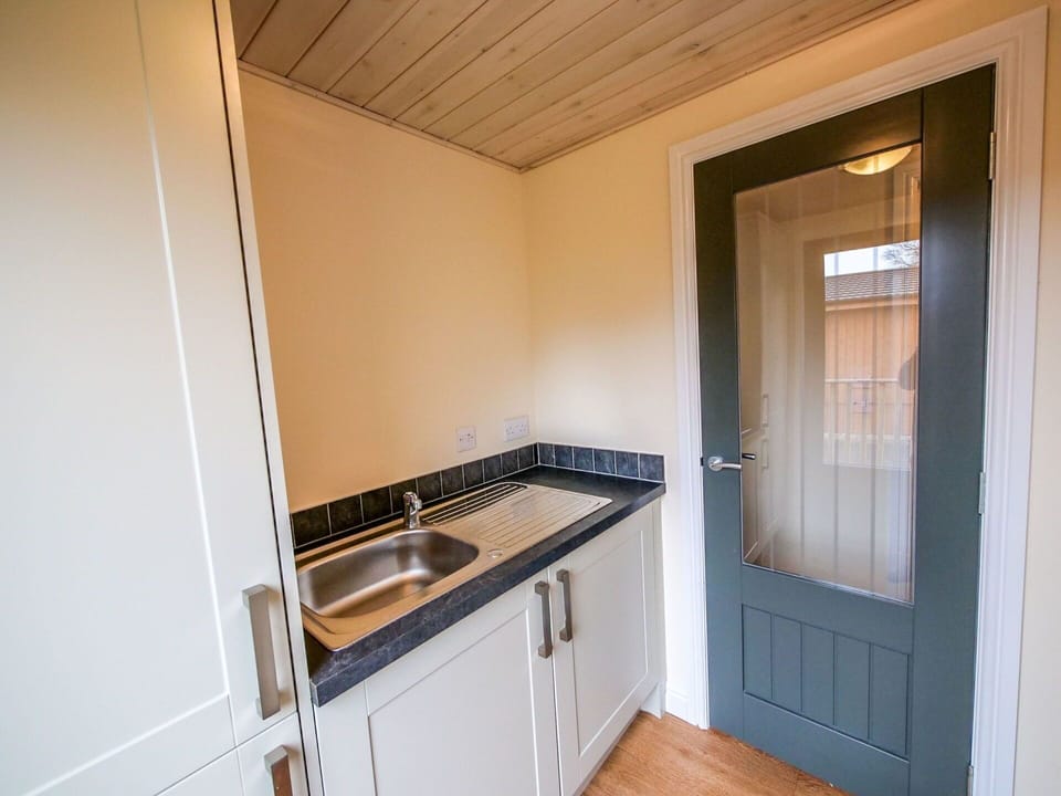 Property, Cabinetry, Kitchen Appliance, Wood, Home Appliance, Countertop, Kitchen, Floor, Kitchen Sink, Kitchen Stove