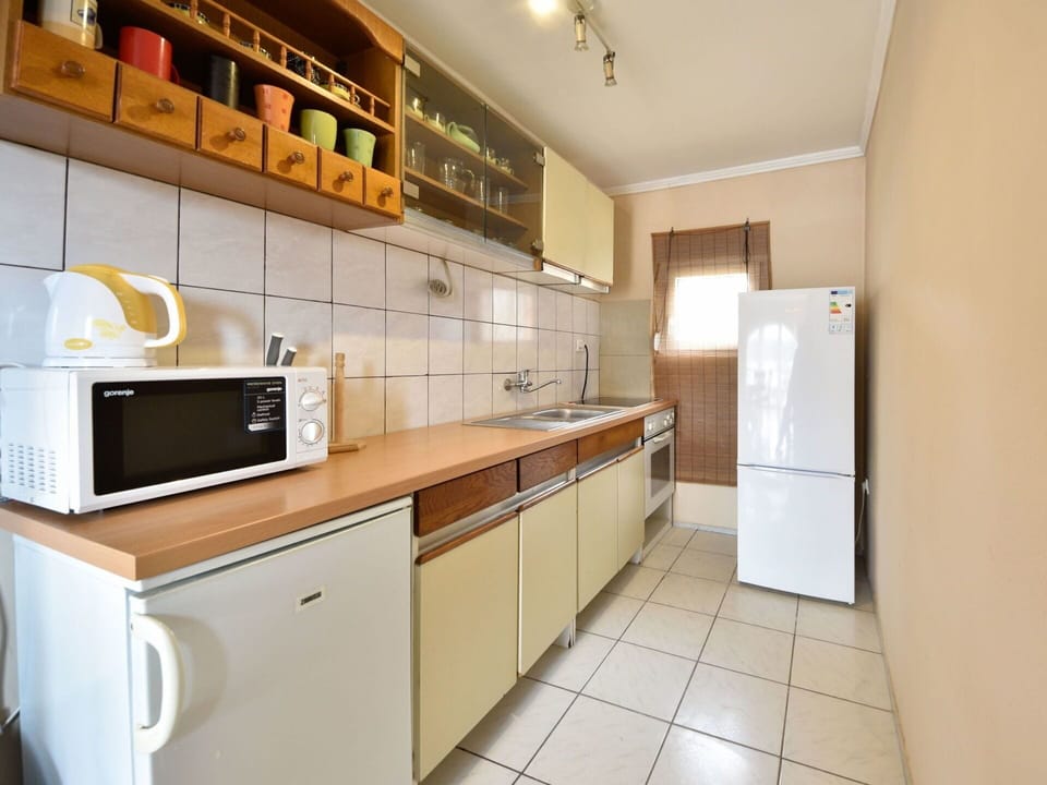 Cabinetry, Countertop, Furniture, Building, Kitchen Appliance, Kitchen Stove, Kitchen, Wood, Home Appliance, Flooring