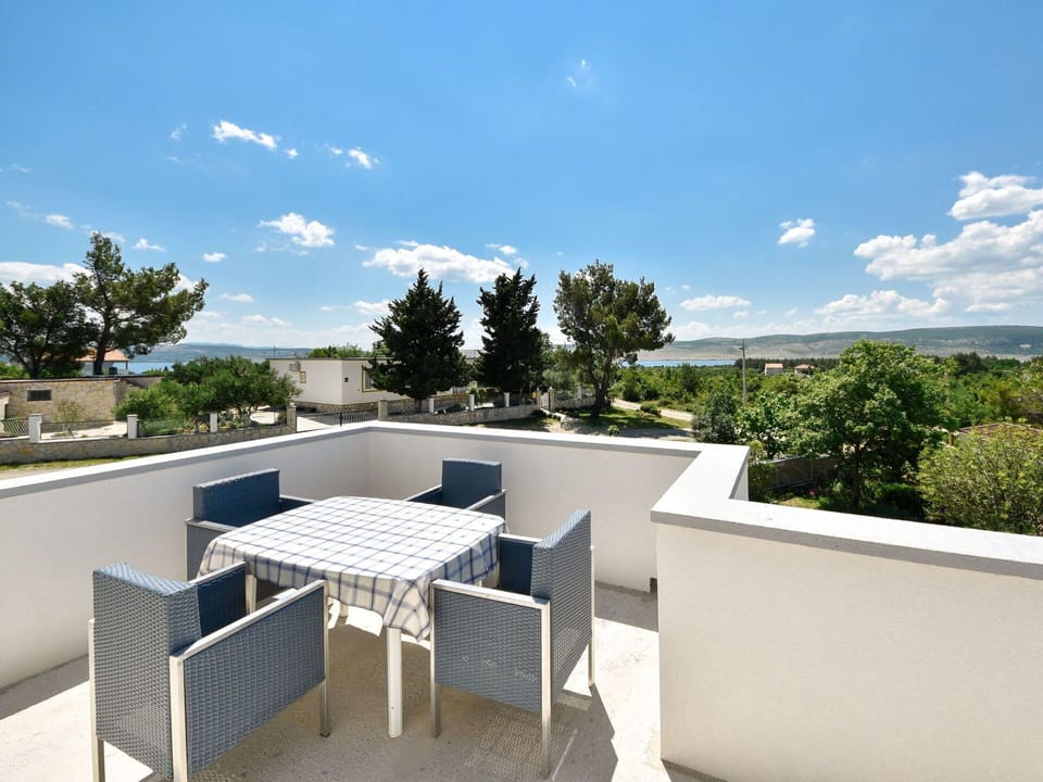 Sky, Cloud, Table, Property, Furniture, Building, Azure, Shade, Chair, Tree