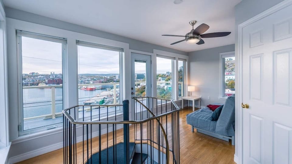 The upper loft, featuring a futon that converts into a bed,  has its own deck with eye-popping view,  and adjoining bathroom