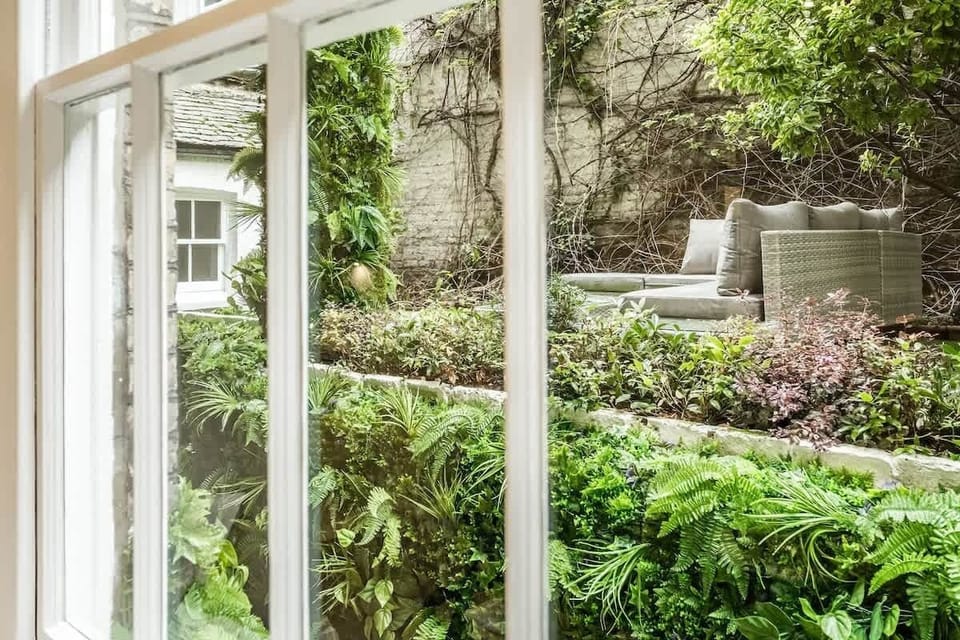 Garden | Exquisitely Designed Private Garden Oasis with Inviting Seating Area