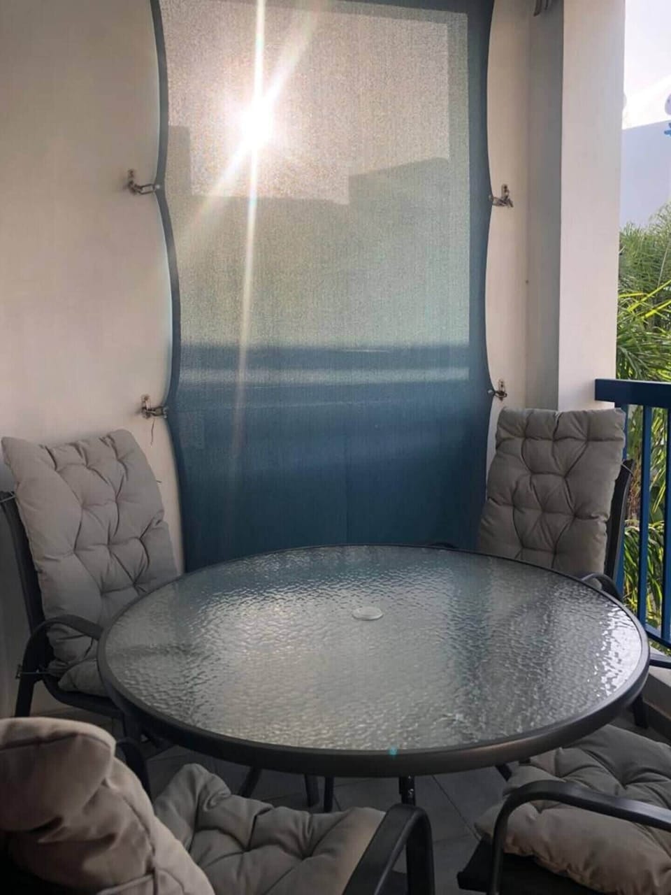 Balcony with comfortable seating for 4 and pool view 