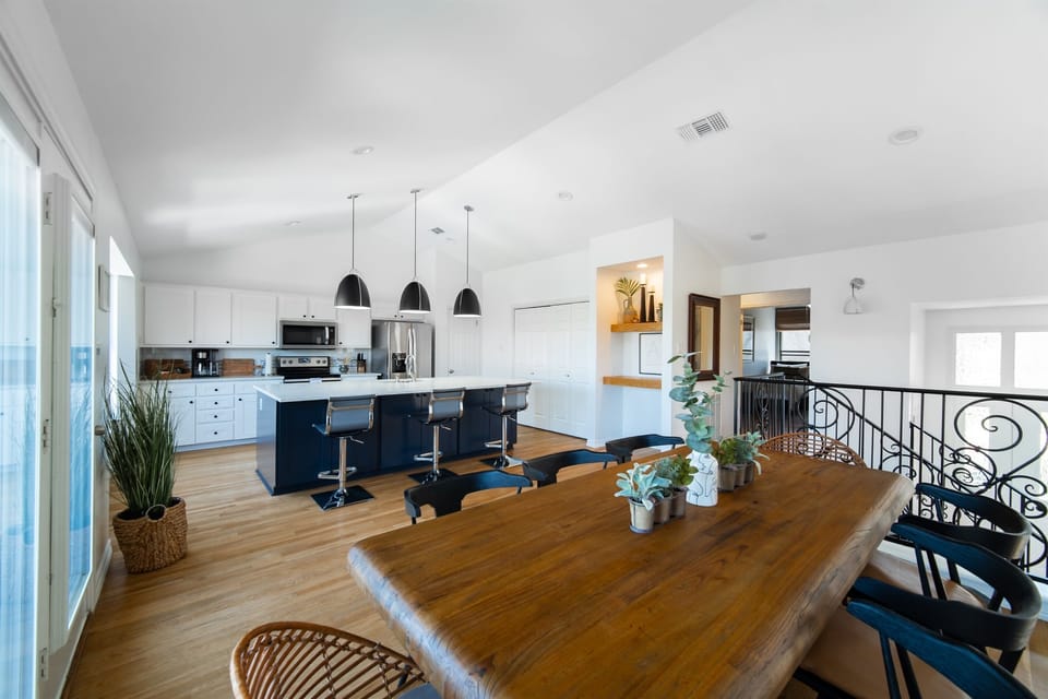 Cozy kitchen and dining room area with laminate and wood flooring.