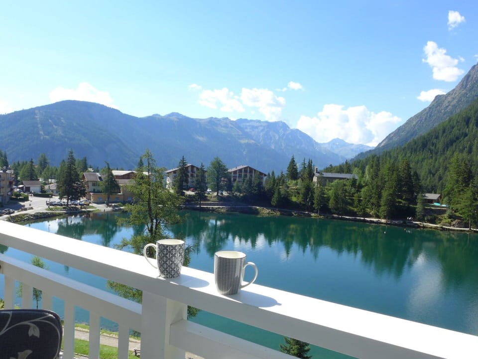 Cloud, Sky, Water, Mountain, Building, Highland, Tree, Body Of Water, Window, Lake