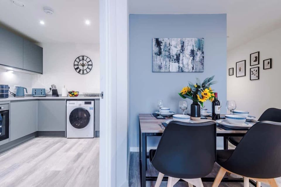 The open-plan living room and dining area benefit from a 50-inch Smart TV, a 6-seater dining table, plenty of space to sit down in the evenings, a double sofa bed and a sizable balcony.