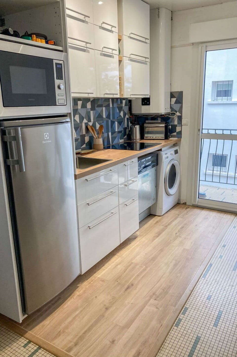 Cabinetry, Countertop, Kitchen Appliance, Kitchen Stove, Kitchen, Home Appliance, Wood, Microwave Oven, Stove, Flooring