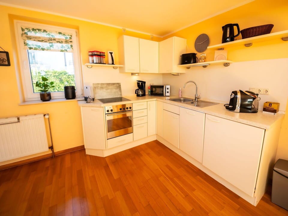 Cabinetry, Countertop, Kitchen Appliance, Kitchen, Kitchen Stove, Home Appliance, Wood, Houseplant, Interior Design, Flooring