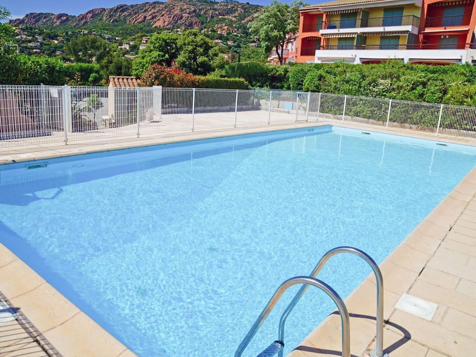 Water, Property, Plant, Swimming Pool, Building, Azure, Sky, Outdoor Furniture, Shade, Tree
