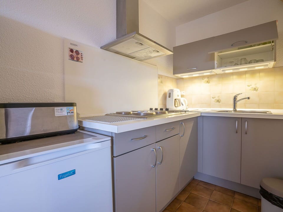 Cabinetry, Countertop, Property, Sink, Kitchen, Tap, Kitchen Stove, Lighting, Gas Stove, Interior Design