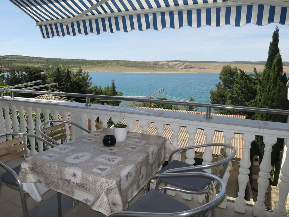 Water, Sky, Table, Property, Tableware, Furniture, Plant, Chair, Outdoor Table, Outdoor Furniture