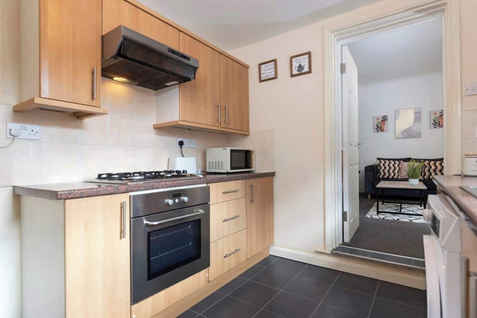 Cook up your favourite meals in this practical kitchen, complete with modern appliances and generous workspace.