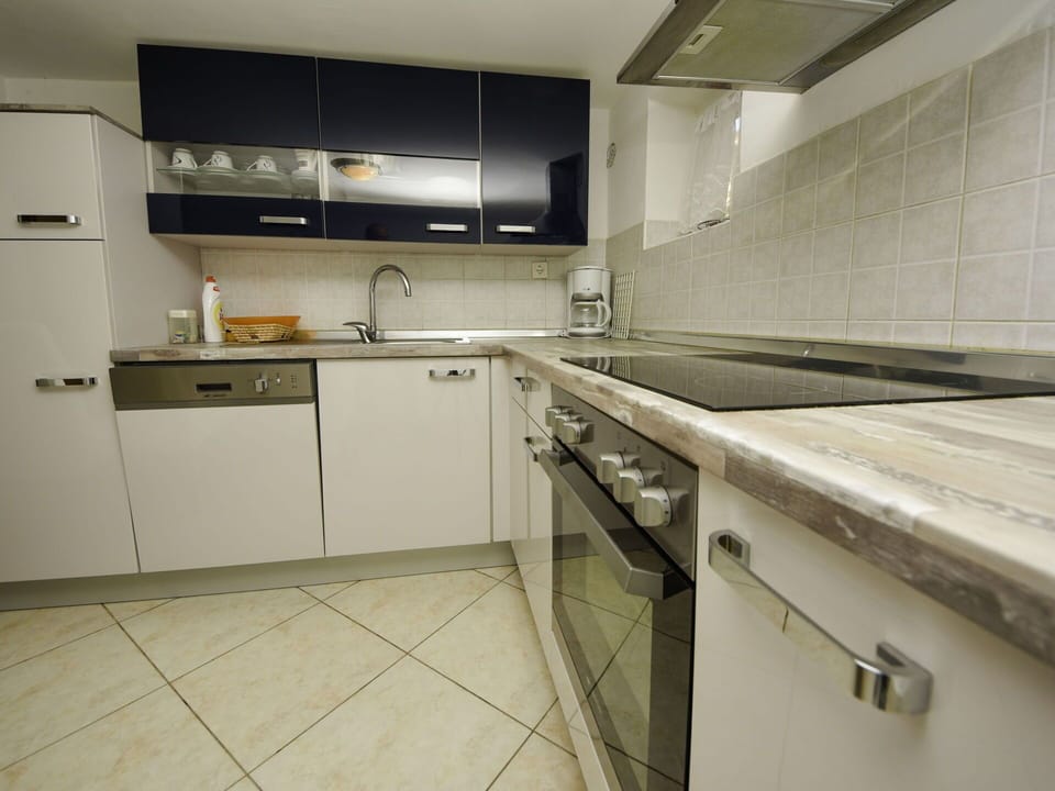 Countertop, Cabinetry, Kitchen Sink, Furniture, Sink, Tap, Kitchen Stove, Kitchen Appliance, Kitchen, Home Appliance