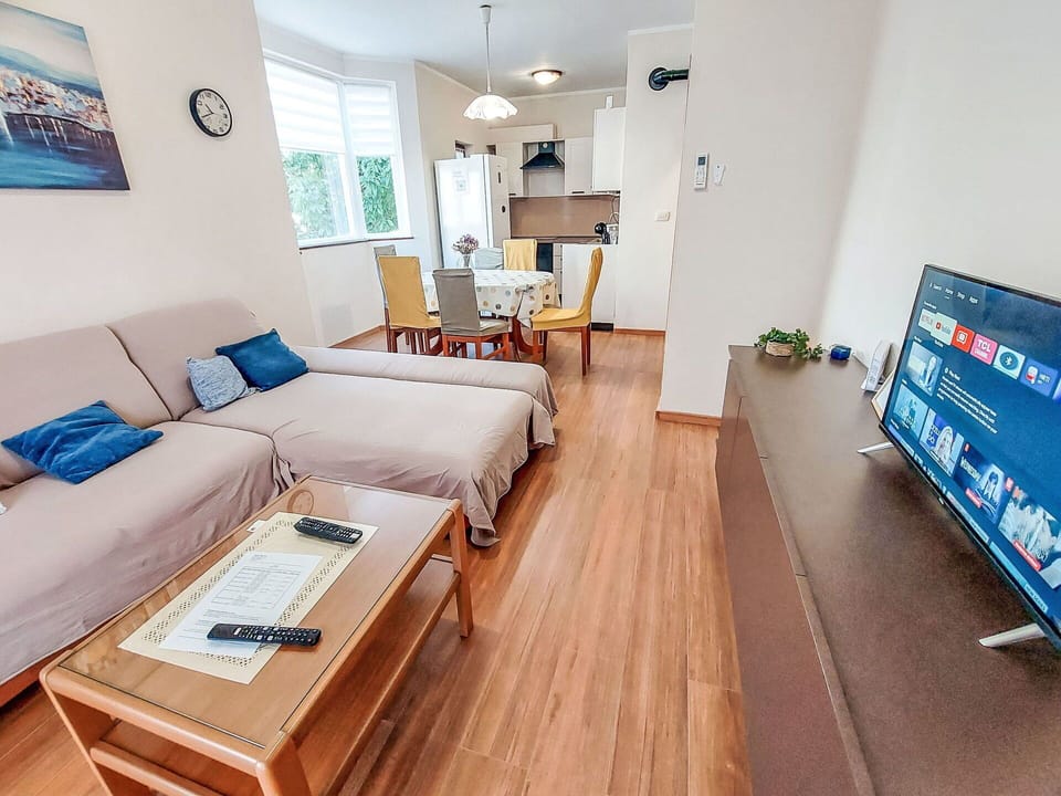 Furniture, Interior Design, Flooring, Floor, Couch, Wood, Room, Wood Flooring, Table, Living Room