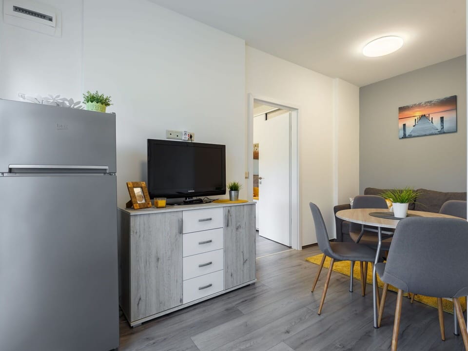 Building, Furniture, Cabinetry, Table, Chair, Television, Drawer, Houseplant, Lighting, Chest Of Drawers