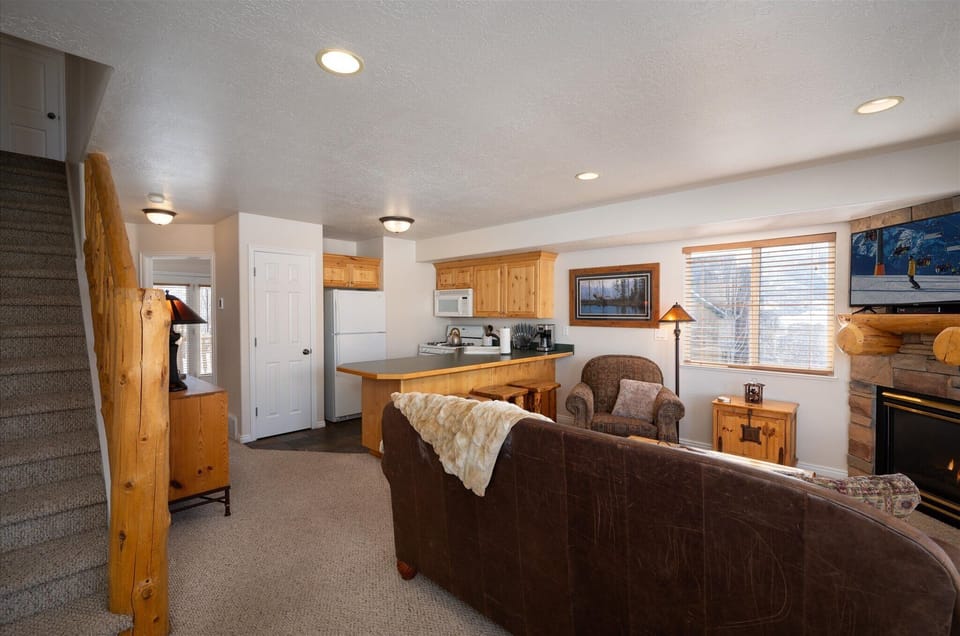 Adjacent to the living room, find access to the upstairs bedrooms, seamlessly extending the comfort and convenience of your stay.