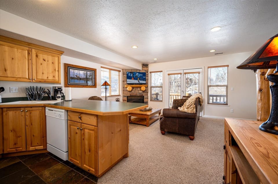 Experience seamless communication with friends and guests in the open-concept floor plan.