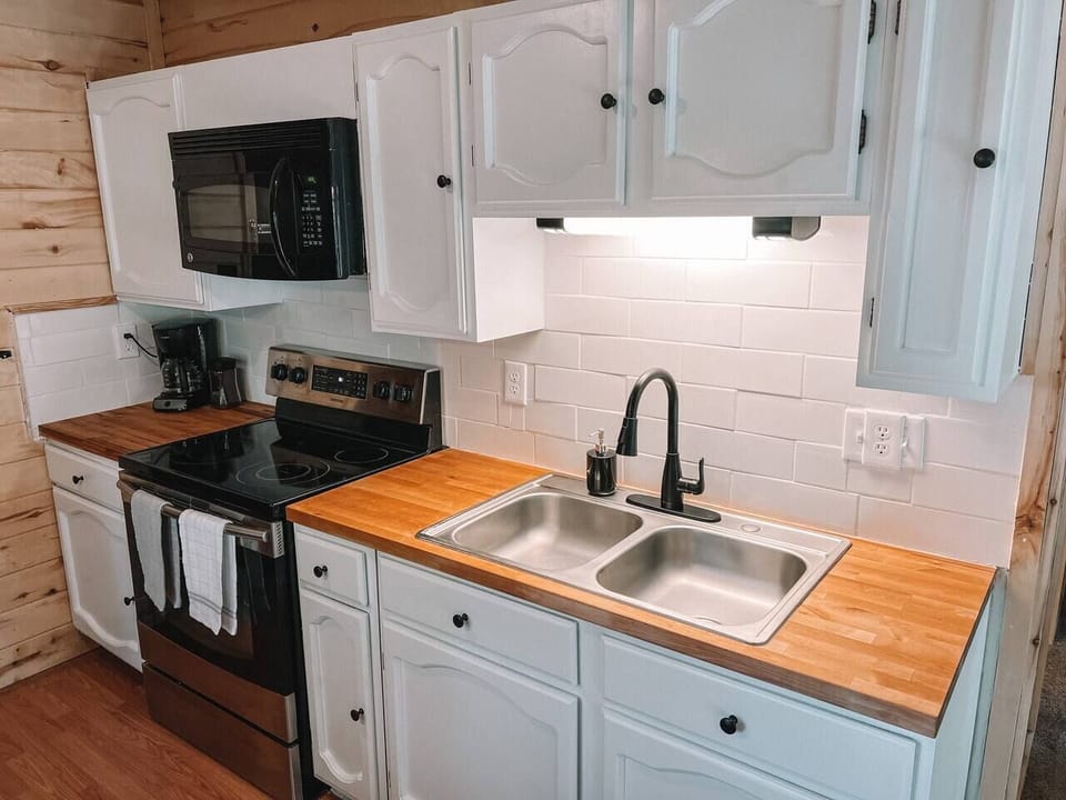 Completely renovated kitchen, fully supplied with pots, pans, silverware, and spices. For those that enjoy cooking in, you’ll have everything you need. 