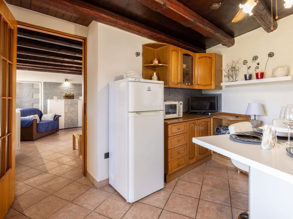 Cabinetry, Building, Countertop, Kitchen Appliance, Kitchen, Kitchen Stove, Home Appliance, Wood, Lighting, Flooring