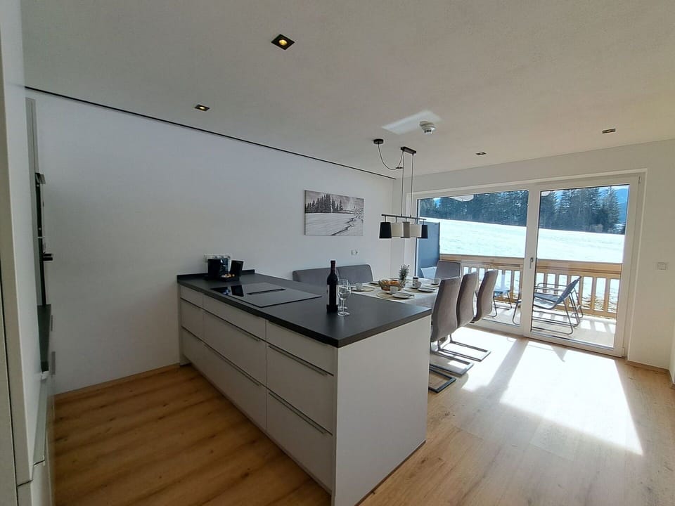 Flooring, Interior Design, Wood, Floor, Wood Flooring, Countertop, Kitchen, Furniture, Ceiling, Room