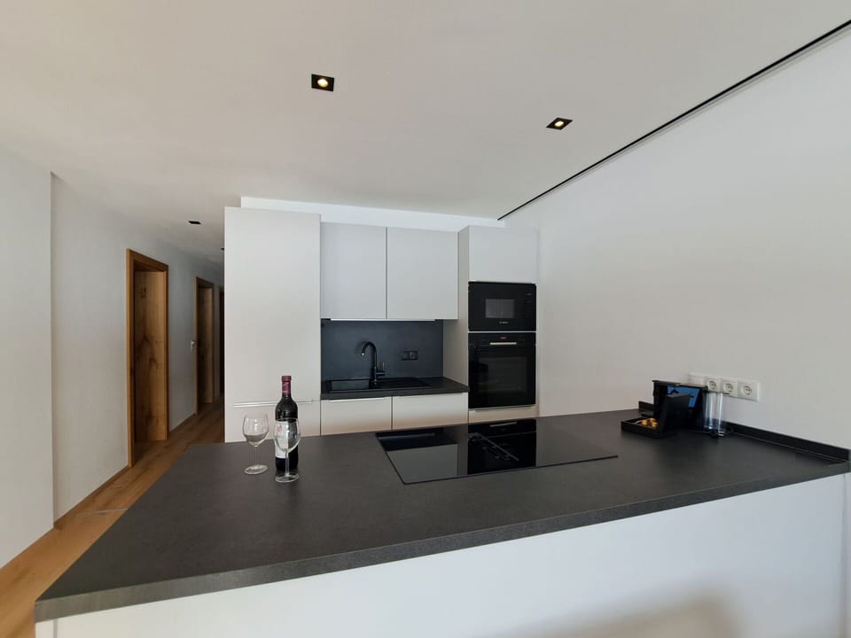 Interior Design, Kitchen, Countertop, Flooring, Wall, Ceiling, Wood, Floor, Light Fixture, Room