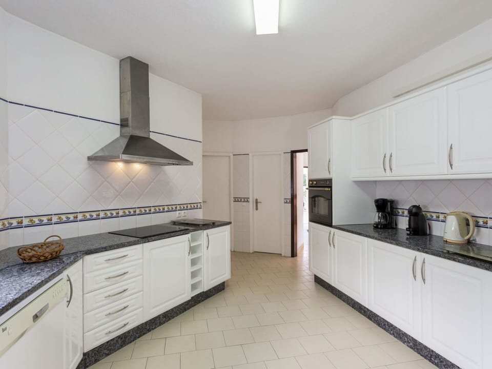 Cabinetry, Countertop, Building, Kitchen Appliance, Kitchen Stove, Kitchen, Exhaust Hood, Gas Stove, Interior Design, Home Appliance