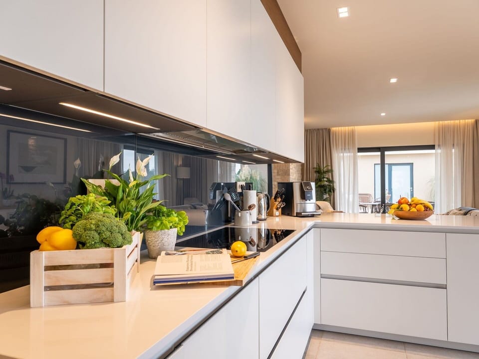 Kitchen, Interior Design, Countertop, Kitchen Appliance, Cabinetry, Flooring, Light Fixture, Furniture, Ceiling, Lighting