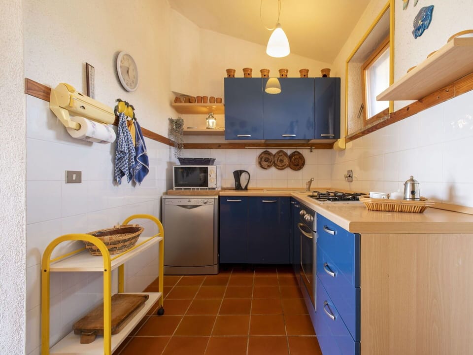 Cabinetry, Property, Kitchen Sink, Sink, Countertop, Tap, Kitchen, Interior Design, Yellow, Kitchen Stove