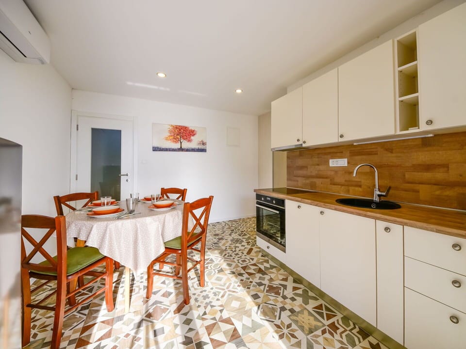 Cabinetry, Furniture, Countertop, Sink, Table, Tap, Wood, Drawer, Building, Chair